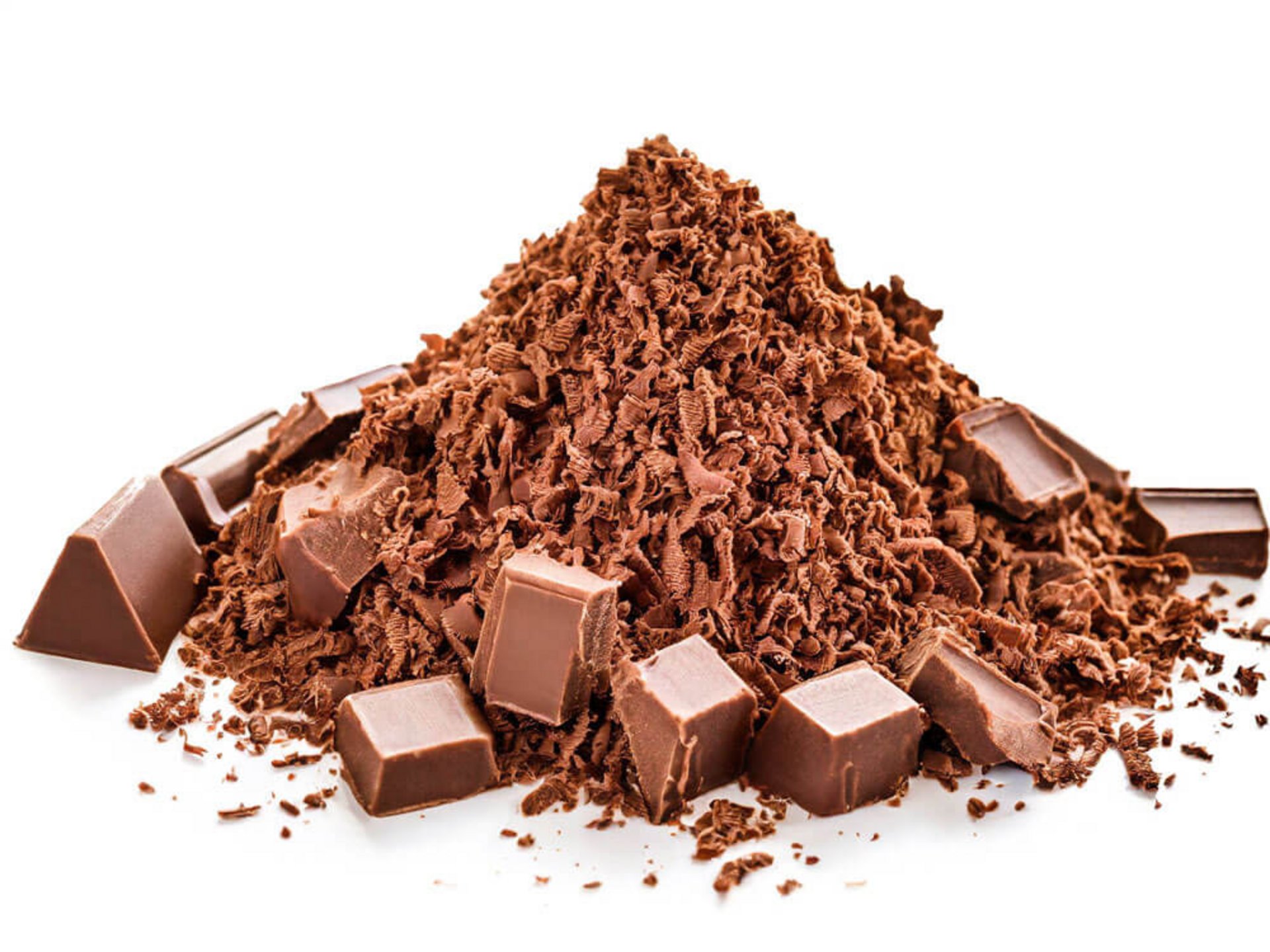 Schokoflocken und Stückchen auf weißem Grund – welche Schokolade zum Raspeln und als Topping verwenden