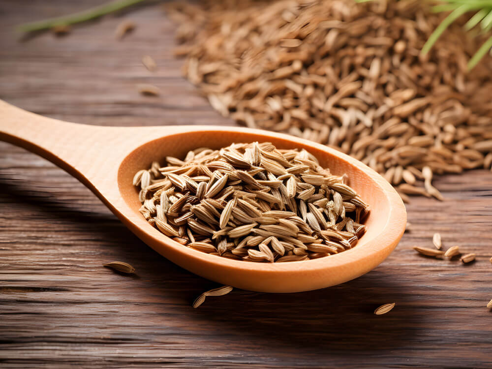 Löffel mit Gewürzsamen Kreuzkümmel Zutat